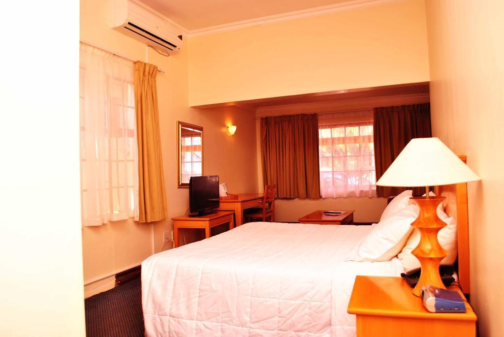 The George Hotel Manzini Phòng bức ảnh