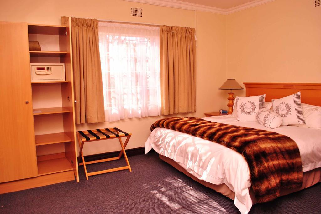 The George Hotel Manzini Phòng bức ảnh